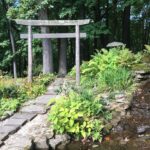 A stone path leading to a shrine in the woods. Stan Hywet Gardens