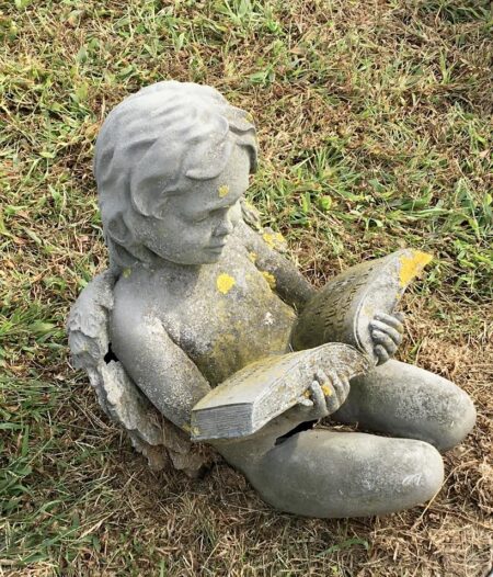 angel statuary- boy reading book