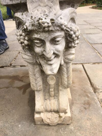 mythical figure on bench end