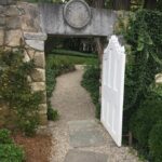 path with door through wall. The Fells, NH