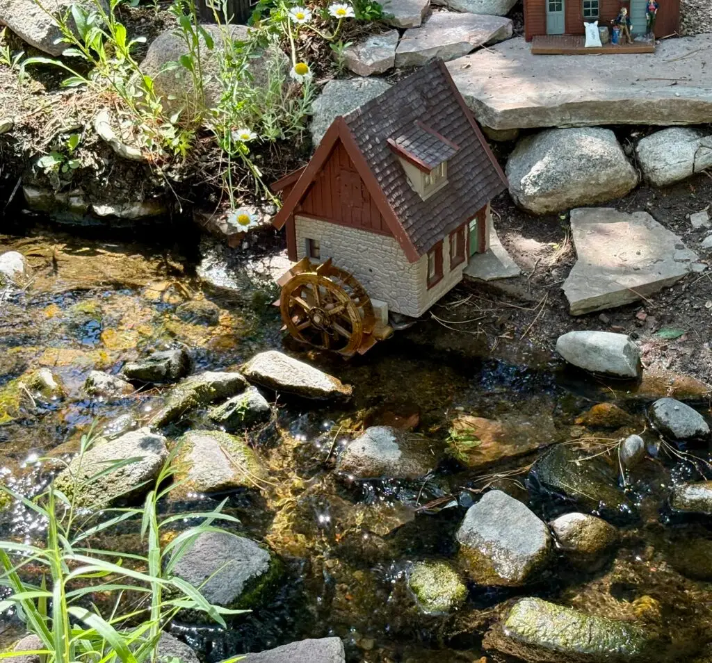 miniature mill of model train set up travel time
