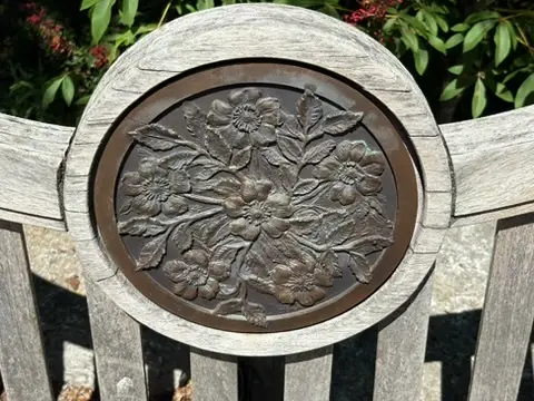 Wood carving detail on bench at Cheekwood